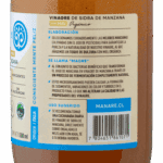 Etiqueta trasera del Vinagre de Sidra de Manzana Manare con Miel Orgánica, detallando su elaboración con manzanas sin pesticidas, la presencia de la "Madre" y uso sugerido: 1 cucharada diaria en ensaladas o bebidas. Incluye código de barras.